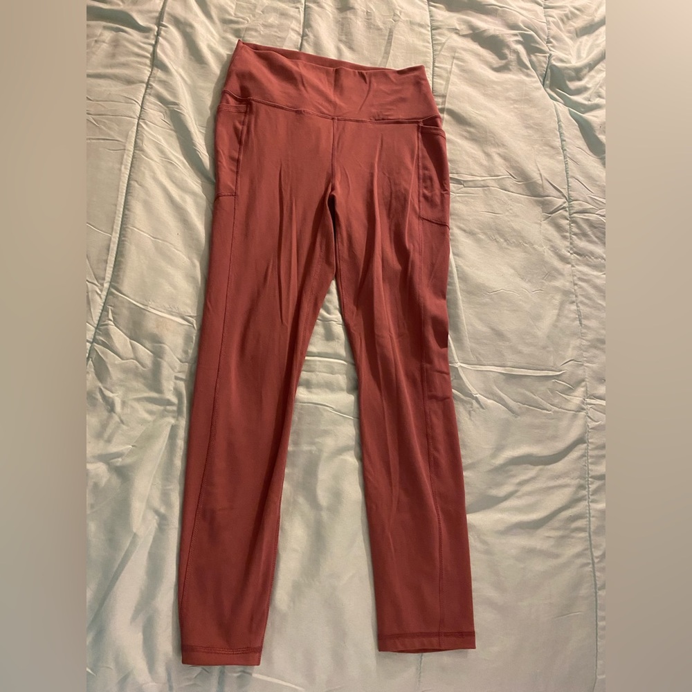 Pink ish RBX leggings, size large.